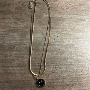 Gold and Black Necklace with Delicate Chain and Circular Pendant